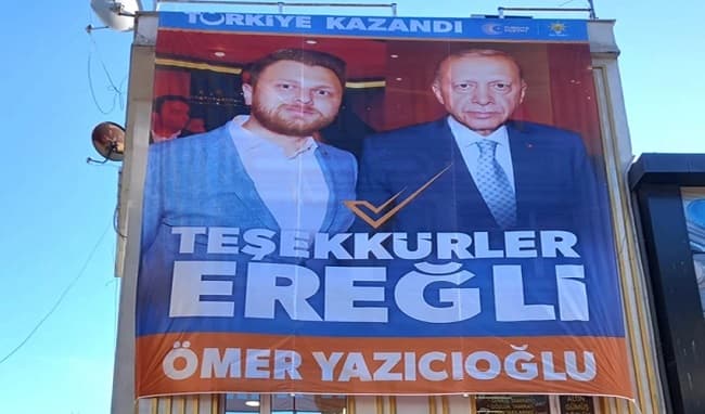 Street billboard reading “Türkiye Kazandı — Teşekkürler Ereğli”, showing Ömer Yazıcıoğlu and President Recep Tayyip Erdoğan