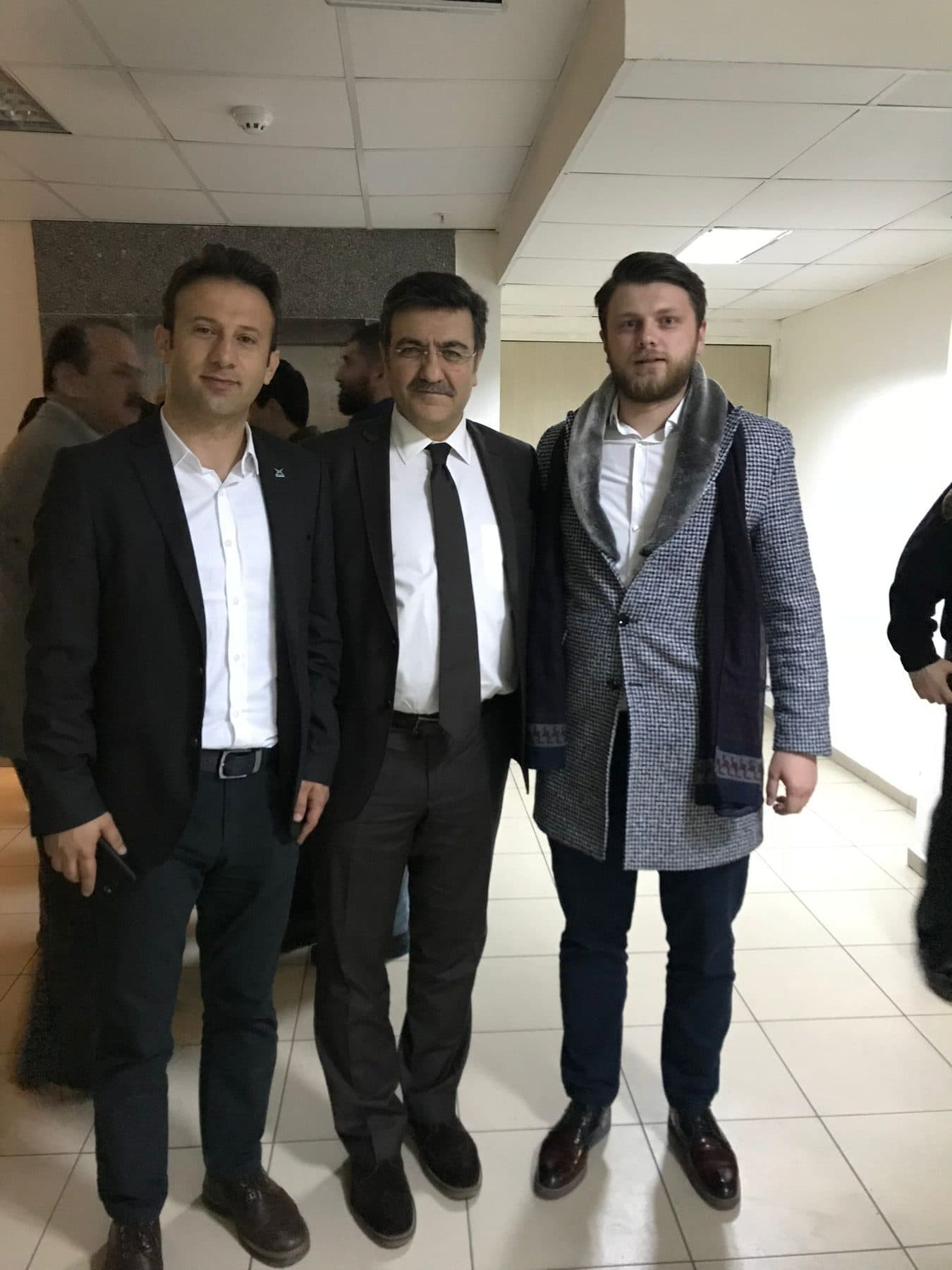 Ömer Yazıcıoğlu with two other people indoors